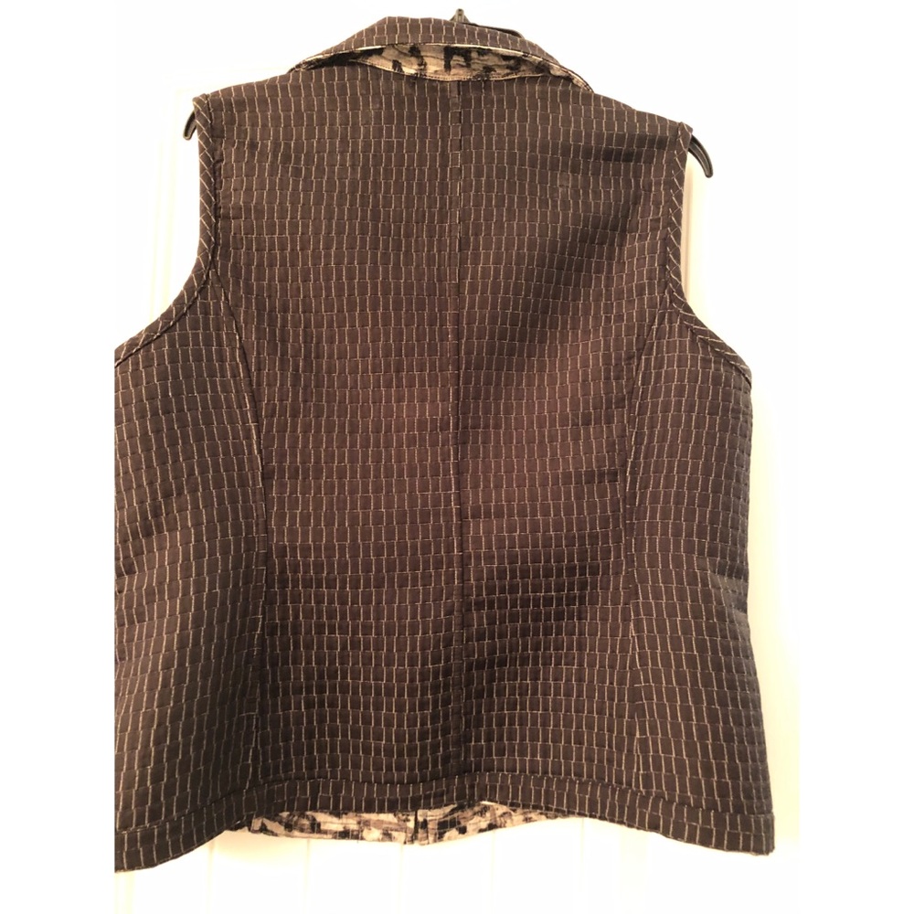 Christopher Bank’s reversible zippered vest.